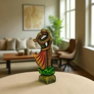 Romantic clay couple statue placed on a beige table in a cozy, modern living room with natural light.