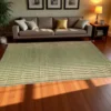 Large Korai grass mat placed on wooden floor in a cozy living room with sofa, cushions, and warm lighting