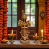 Handmade burnt clay Maa Durga idol placed on a decorated altar with marigold garlands, oil lamps, and offerings.