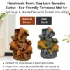 Infographic of handmade burnt clay Lord Ganesha statues in two color variants (Natural Brown and Dark Black), with product details, size 6.5×4×3 inch, weight 600g, and highlighted features for puja, meditation, and gifting.