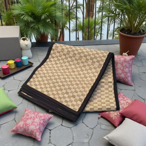 Folded Handwoven Korai Grass Mat with Black Border – Eco-Friendly Outdoor Floor Mat
