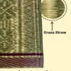 Close-up of handwoven Madurkathi reed grass mat highlighting natural grass straw material and traditional weaving texture