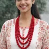 Indian woman wearing handmade red fabric bead multi-layer necklace with traditional kurta outfit