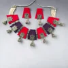 Handmade fabric necklace set with red and purple panels, oxidized silver charms, pearl thread detailing, and matching jhumka earrings.